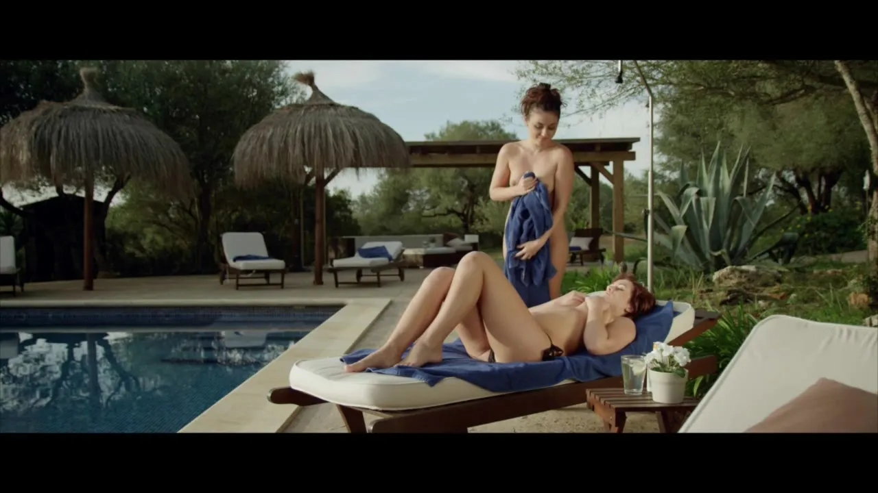 Young lesbians by the pool